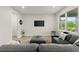 Cozy living room features neutral tones and a large window at 72 Aurora Ave, Ponce Inlet, FL 32127