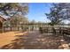 Spacious back deck with seating, great for entertaining and enjoying the serene view of the water and trees at 725 E New York Ave, Orange City, FL 32763