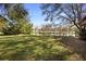 Lush backyard with pond views offering a serene and private outdoor space at 725 E New York Ave, Orange City, FL 32763