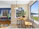 Bright breakfast nook featuring large windows, a view of the serene outdoors, and comfortable seating at 725 E New York Ave, Orange City, FL 32763