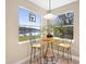 Cozy breakfast nook with views of the serene outdoor scenery at 725 E New York Ave, Orange City, FL 32763