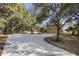 Long concrete driveway leading to a beautiful single Gathering home with a two car garage at 725 E New York Ave, Orange City, FL 32763