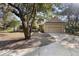 Charming two-story home with well-maintained landscaping and a welcoming entrance at 725 E New York Ave, Orange City, FL 32763