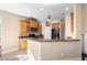 Bright eat-in kitchen with light wood cabinets, and stainless steel appliances at 725 E New York Ave, Orange City, FL 32763