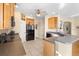 Bright kitchen with ample counter space and black appliances at 725 E New York Ave, Orange City, FL 32763