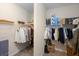 Functional walk-in closet providing ample storage space for an organized wardrobe and accessories at 725 E New York Ave, Orange City, FL 32763