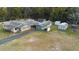 Aerial view of the home's layout showcasing the detached garage and additional storage sheds at 753 Glenwood Rd, Deland, FL 32720