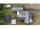 Drone shot displaying the home and accessory buildings from above, showing the roof conditions at 753 Glenwood Rd, Deland, FL 32720