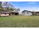 View of the backyard with multiple sheds and outbuildings, showing the property's storage capacity at 753 Glenwood Rd, Deland, FL 32720