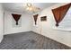 Empty bedroom featuring three windows with tied back curtains and a ceiling fan at 753 Glenwood Rd, Deland, FL 32720