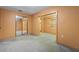 Comfortable bedroom featuring carpeting and closet with sliding mirrored doors at 753 Glenwood Rd, Deland, FL 32720