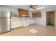 Kitchen with stainless steel refrigerator and white appliances at 753 Glenwood Rd, Deland, FL 32720