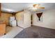 Open floor plan showing the living room and kitchen with retro decor and ceiling fan at 753 Glenwood Rd, Deland, FL 32720