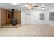Inviting living room featuring a wood burning stove, tile flooring, and natural light at 753 Glenwood Rd, Deland, FL 32720
