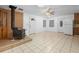 Spacious living room featuring a wood burning stove, tile flooring, and ample natural light at 753 Glenwood Rd, Deland, FL 32720