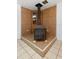 Close up of wood burning stove, complemented by a decorative tile surround at 753 Glenwood Rd, Deland, FL 32720