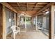 Covered back porch with a seating area, a metal roof, and wood decking at 753 Glenwood Rd, Deland, FL 32720