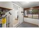 Utility room with a water heater, outlets, and access to the backyard at 753 Glenwood Rd, Deland, FL 32720