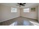 Bedroom with wood-look flooring and ceiling fan at 838 5Th St, Port Orange, FL 32129