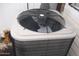 Outdoor air conditioning unit with fan and vent cover, situated near the home exterior at 1101 Monticello Ln # 3, Port Orange, FL 32129