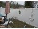 Fenced backyard featuring a white vinyl fence for privacy and a small grassy area, with an anchor as an accent at 1101 Monticello Ln # 3, Port Orange, FL 32129