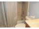 Bathroom with shower-tub combo, tile walls, and a toilet at 1101 Monticello Ln # 3, Port Orange, FL 32129