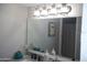 Bathroom vanity with double sinks, updated fixtures and decor, and a modern lighting fixture at 1101 Monticello Ln # 3, Port Orange, FL 32129