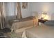 Bedroom with two twin beds features neutral walls, laminate floors, and natural light at 1101 Monticello Ln # 3, Port Orange, FL 32129