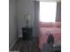 Bedroom features neutral walls, laminate floors, and natural light at 1101 Monticello Ln # 3, Port Orange, FL 32129