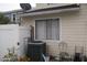 View of the side of the home with window and AC unit at 1101 Monticello Ln # 3, Port Orange, FL 32129