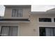 Two-story home with large windows and light colored siding at 1101 Monticello Ln # 3, Port Orange, FL 32129