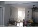 Living room features a ceiling fan, stairs to loft, and wood laminate floors at 1101 Monticello Ln # 3, Port Orange, FL 32129