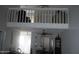 Bright living room with an overhead loft, offering extra space and a unique architectural feature at 1101 Monticello Ln # 3, Port Orange, FL 32129
