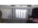 Loft area with a railing overlooking the living room at 1101 Monticello Ln # 3, Port Orange, FL 32129