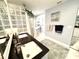 Contemporary bathroom featuring a glass block wall, double sink vanity with granite countertop, and a lighted mirror at 112 Muscovy Ct, Daytona Beach, FL 32119