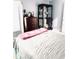 Bedroom with neutral walls and a large dresser and curio cabinet at 112 Muscovy Ct, Daytona Beach, FL 32119