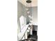 Bright entryway features unique hanging light fixture and large windows at 112 Muscovy Ct, Daytona Beach, FL 32119