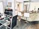 Stylish kitchen featuring granite countertops, a stone-accented island, stainless appliances, and an adjacent dining area at 112 Muscovy Ct, Daytona Beach, FL 32119