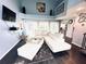 Spacious living room with vaulted ceilings, hardwood floors, and large windows overlooking the backyard at 112 Muscovy Ct, Daytona Beach, FL 32119