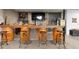 Close-up of the basement bar with wood countertop and barrel base at 12736 Lake Ridge Cir, Clermont, FL 34711