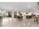 Spacious basement with a pool table, seating area, and sliding glass doors to the outside at 12736 Lake Ridge Cir, Clermont, FL 34711