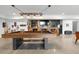 Basement game room featuring a pool table and custom bar area at 12736 Lake Ridge Cir, Clermont, FL 34711