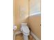 Cozy bathroom featuring a modern toilet and decorative wall art above at 12736 Lake Ridge Cir, Clermont, FL 34711