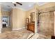 Spacious bathroom with a double vanity, walk-in shower, and neutral color scheme, offering a spa-like experience at 12736 Lake Ridge Cir, Clermont, FL 34711