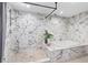Luxurious bathroom with a soaking tub, elegant marble shower, and modern fixtures for a spa-like experience at 12736 Lake Ridge Cir, Clermont, FL 34711