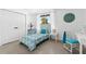 Charming bedroom with bright decor, patterned bedding, and ample natural light for a cozy and inviting space at 12736 Lake Ridge Cir, Clermont, FL 34711