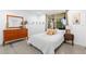 Serene bedroom with a large window, soft natural light, and minimalist decor for a peaceful retreat at 12736 Lake Ridge Cir, Clermont, FL 34711