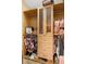Organized closet with custom shelving, drawers, and hanging racks for clothes and accessories at 12736 Lake Ridge Cir, Clermont, FL 34711