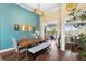 Bright dining room featuring hardwood floors, ample seating, and stylish decor at 12736 Lake Ridge Cir, Clermont, FL 34711