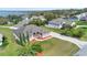 Gorgeous house with well-maintained landscaping, and a view of the serene lake at 12736 Lake Ridge Cir, Clermont, FL 34711